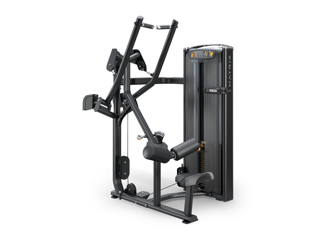 Matrix fitness dual-density cable machine in black with gold accents, shown from a three-quarter angle on a white background.