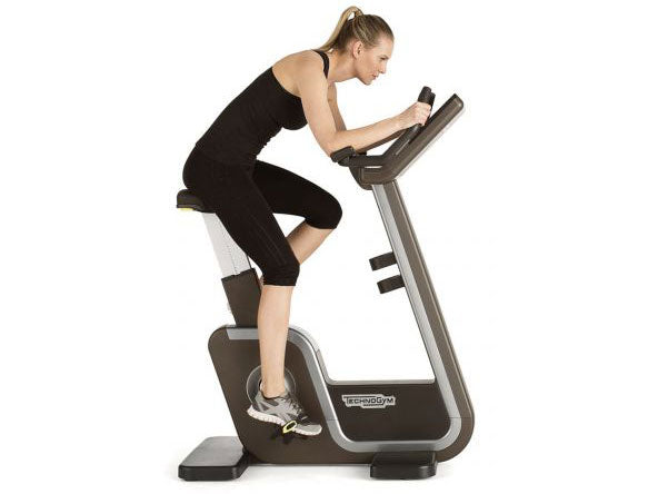 Used Technogym ARTIS Upright Bike with Bent Rider
